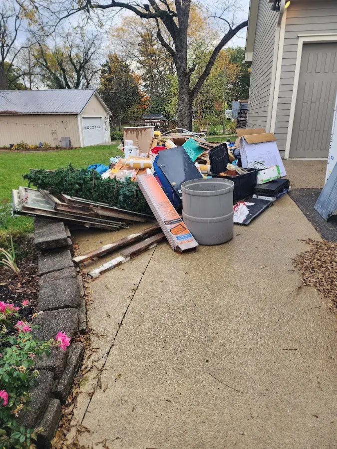 Dumpster being loaded with debris for 3 Yard Dumpster Rental in Morris